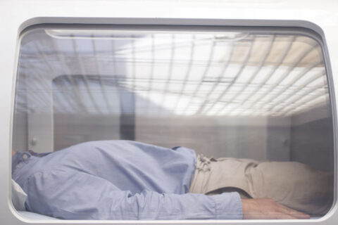 A man lying comfortably inside a hyperbaric oxygen therapy chamber during an HBOT session, receiving concentrated oxygen to promote healing and recovery.
