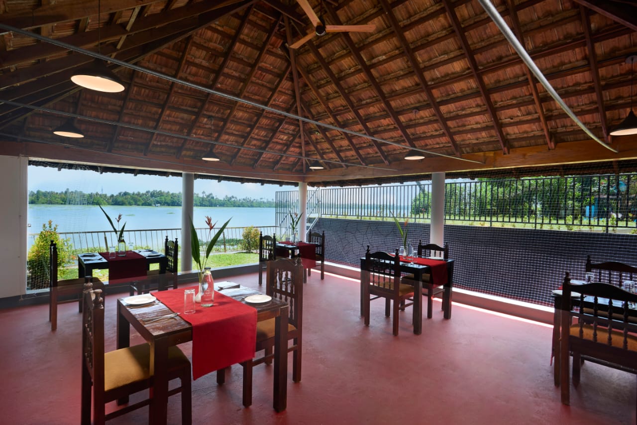 “Beach-view dining space at Akanta Ayurveda & Yoga Cherai with elegant seating and a serene coastal ambience.”