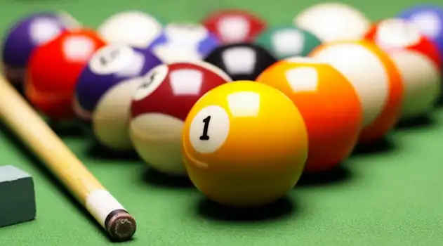 Indoor games area at Misty Lake Resort featuring carrom, chess, table tennis, and board games for guests to enjoy.