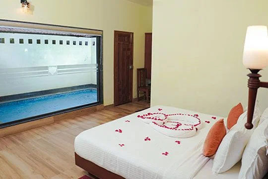 Private pool villa for couples in Vythiri surrounded by lush greenery.