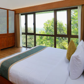 “Luxury resort room at Morickap Resort Wayanad with scenic hillside view and modern amenities”