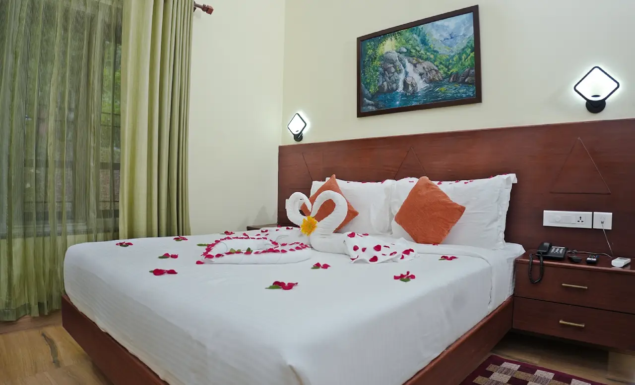 Luxury bedroom at Stride Hotels Wayanad featuring elegant interiors and modern amenities for a comfortable stay.