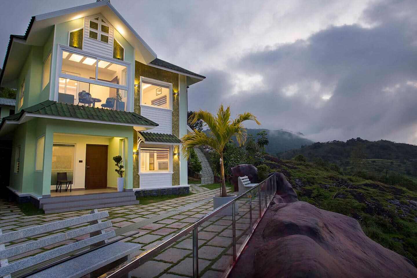 Luxury Family Villa at Foggy Knolls, Vagamon, offering twin bedrooms, mezzanine, living area, and scenic veranda views.