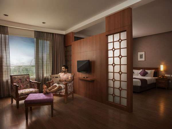 “Luxury bedroom at Monsoon Empress Hotel Kochi with modern décor and comfortable bedding”