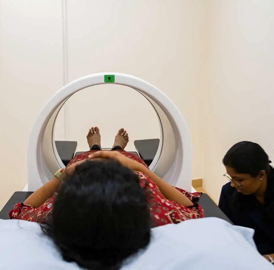 Patient undergoing arthritis wellness programme session with therapist guidance at a modern rehabilitation center