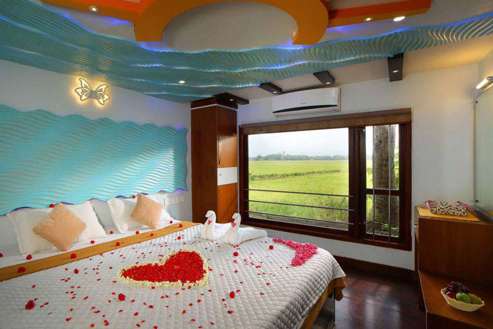 Luxury houseboat bedroom by Southern Panorama in Alleppey with elegant wooden interiors and serene backwater views.