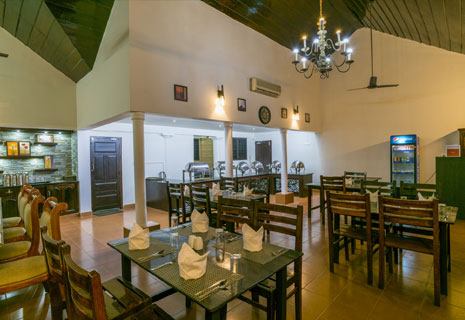 Traditional Kerala seafood and multi-cuisine dishes served at Warmth Lake Haven Island Resort in Alleppey, featuring fresh fish specialties and a variety of vegetarian and non-vegetarian options.