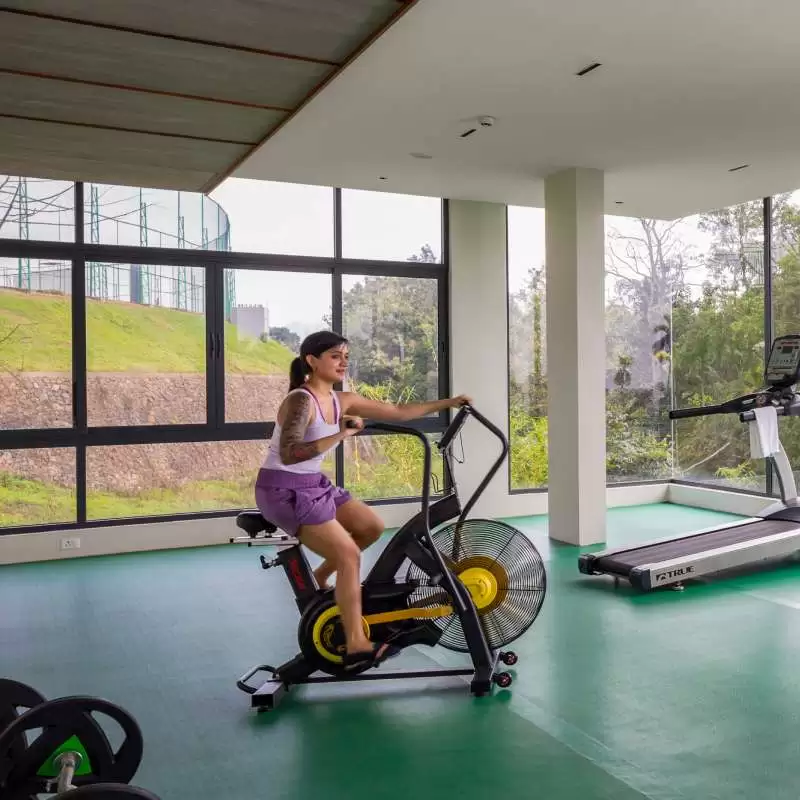 Modern fitness center at Lords 83 resort in Wayanad with well-equipped gym facilities