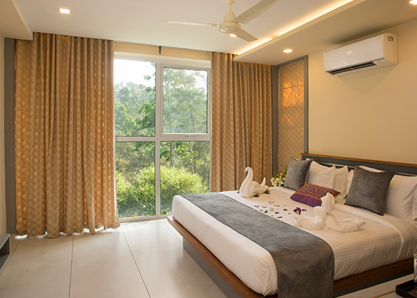 Luxurious and spacious room at Amrezy Resort & Spa in Wayanad with elegant interiors and modern comforts