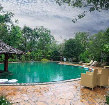 Infinity pool at Morickap Resort in Wayanad with scenic mountain and valley views