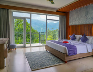 Well-furnished bedroom at Winternote Munnar with warm ambiance and modern amenities