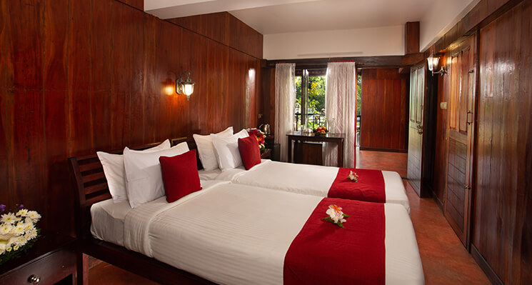 Deluxe room at Akanta Ayurveda & Yoga Cherai with panoramic view of Cherai Beach.