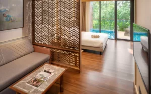 Luxurious bedroom at Lords 83 featuring elegant interiors, cozy bedding, soft lighting, and scenic hill views—perfect for a romantic stay in a luxury honeymoon resort in Wayanad.