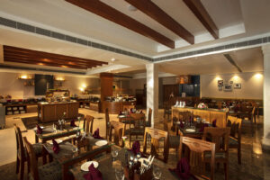 Luxury dining restaurant at Monsoon Empress Kochi with elegant ambiance and multi-cuisine options