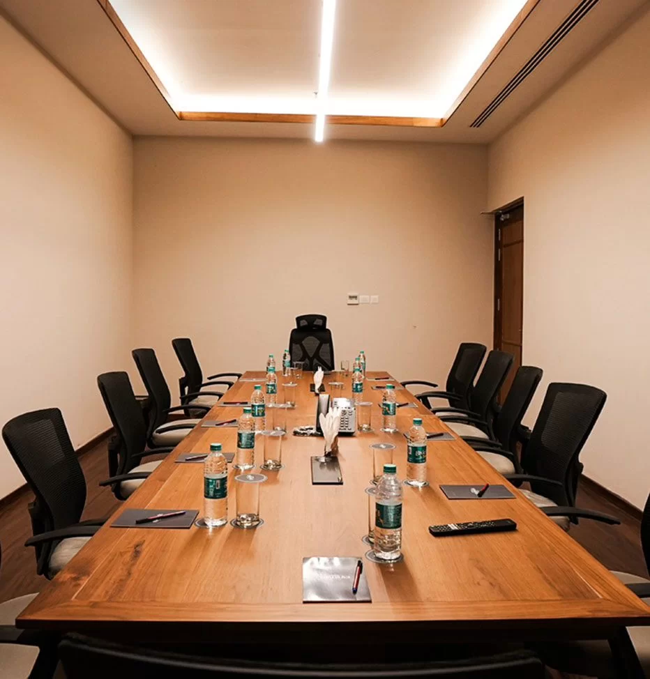 Corporate meeting setup at Morickap Lords 83 Resort in Wayanad with conference seating, projector, and modern business facilities