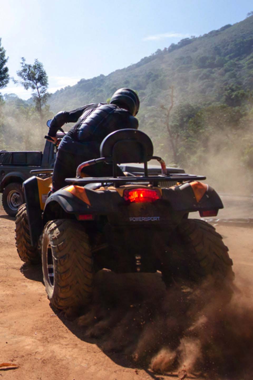 Adventure activities at Misty Woods Resort including kayaking, rope activities, and off-roading in Coorg