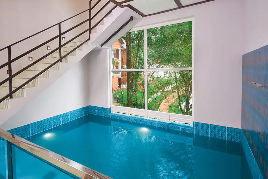 Luxury private pool villa at Era Resort Munnar surrounded by misty hills and lush greenery