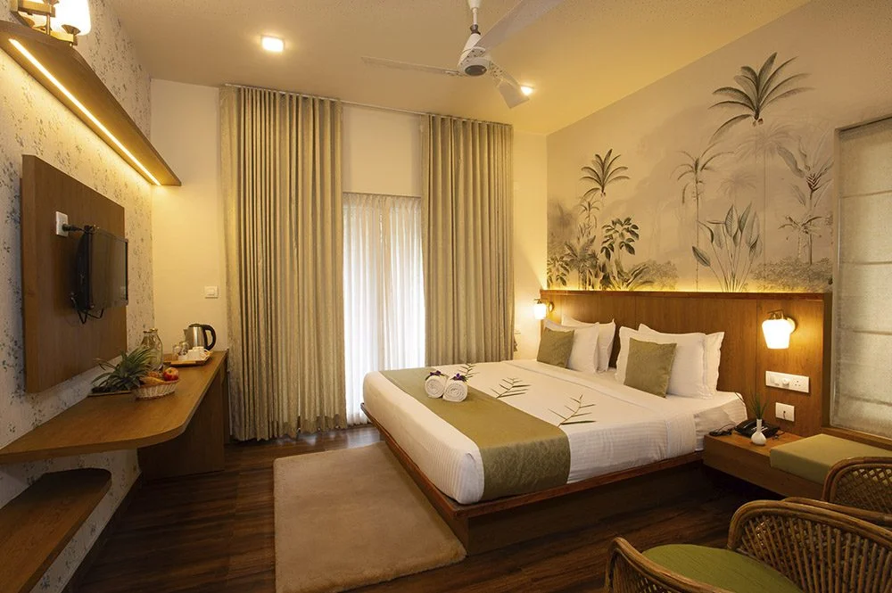 Cozy bedroom at Bamboo Dale Plantation Nature Resort surrounded by peaceful greenery in Munnar