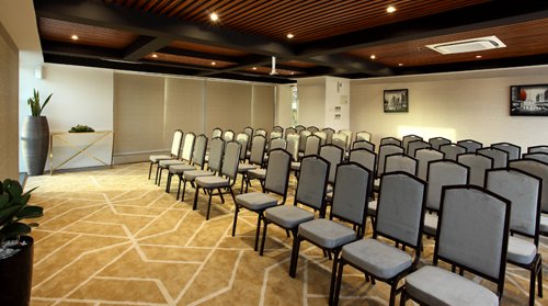 Twelve Tables conference hall at Sugar Business Hotel Kochi with modern seating and corporate meeting setup