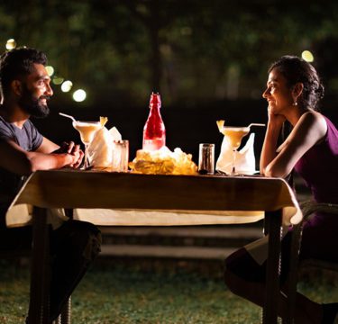 Luxury resort in Wayanad surrounded by misty mountains, lush greenery, and scenic views of the Western Ghats.