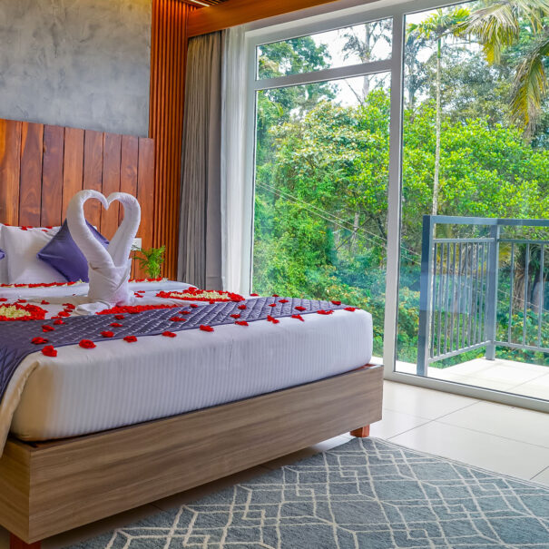 Spacious luxury room at Winternote Munnar with elegant interiors and breathtaking views of the surrounding hills and nature.
