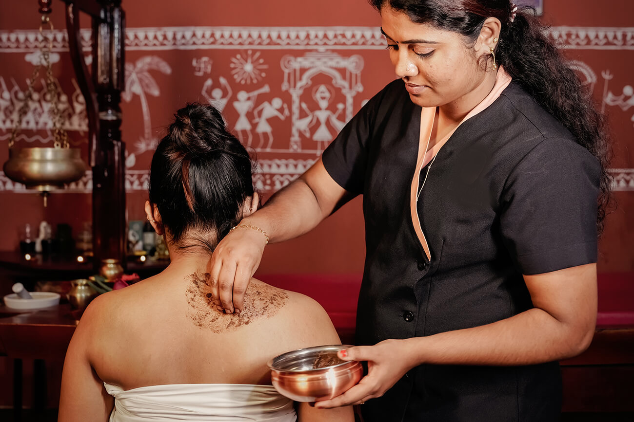 Holistic wellness experience at a beach resort in Kerala with yoga, Ayurveda therapies, and peaceful coastal surroundings