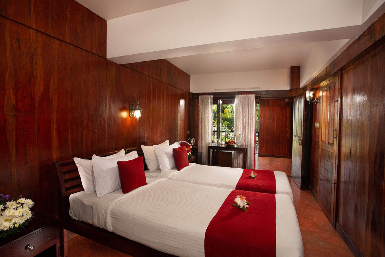Air-conditioned, well furnished bedroom at Akanta Ayurveda & Yoga designed for comfort and Ayurvedic wellness stay.
